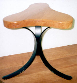 Black iron and oak stool / table.