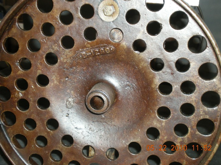 Serial number of 1941 wheat planter wheel visible in casting.