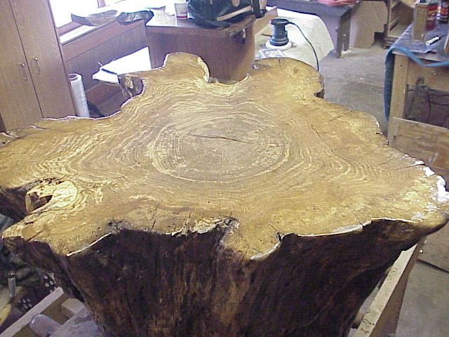 Quite irregular natural edging. This piece lends ittself well for a glass top.