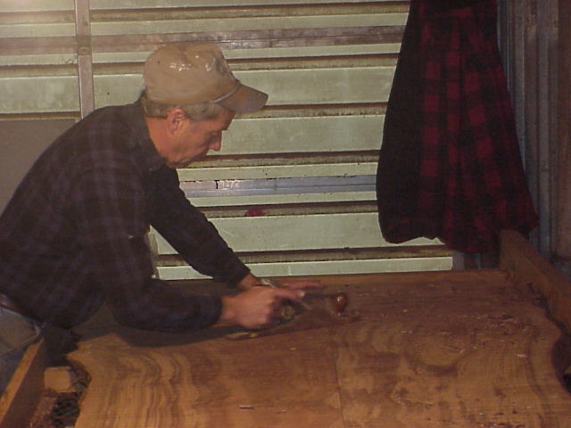 Mike, hand planning the slab. 