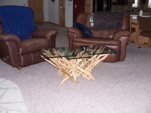 The glass top of this table is 1/2 inch thick with polished pencil edging.