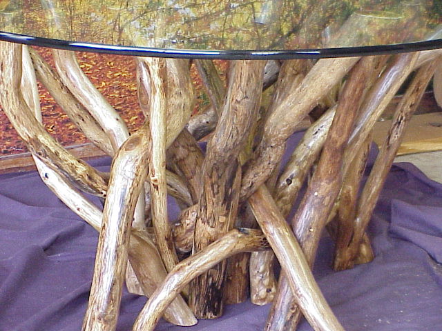 A medium density tangled root dining table..  Polished pencil edging on the table top.