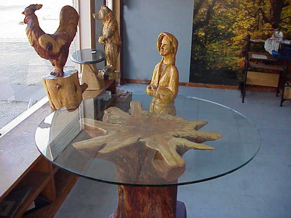 Round single stump tables can seat up to about 8 comfortably with a 7 ft diameter glass and large stump or rootball.