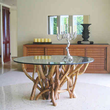 A tangle style of table base with glass top. Refer to _ tangle dining table _